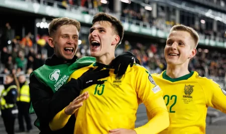 Gvidas Gineitis celebrates scoring for Lithuania against Finland in Group G of UEFA qualifying for the FIFA World Cup 26
